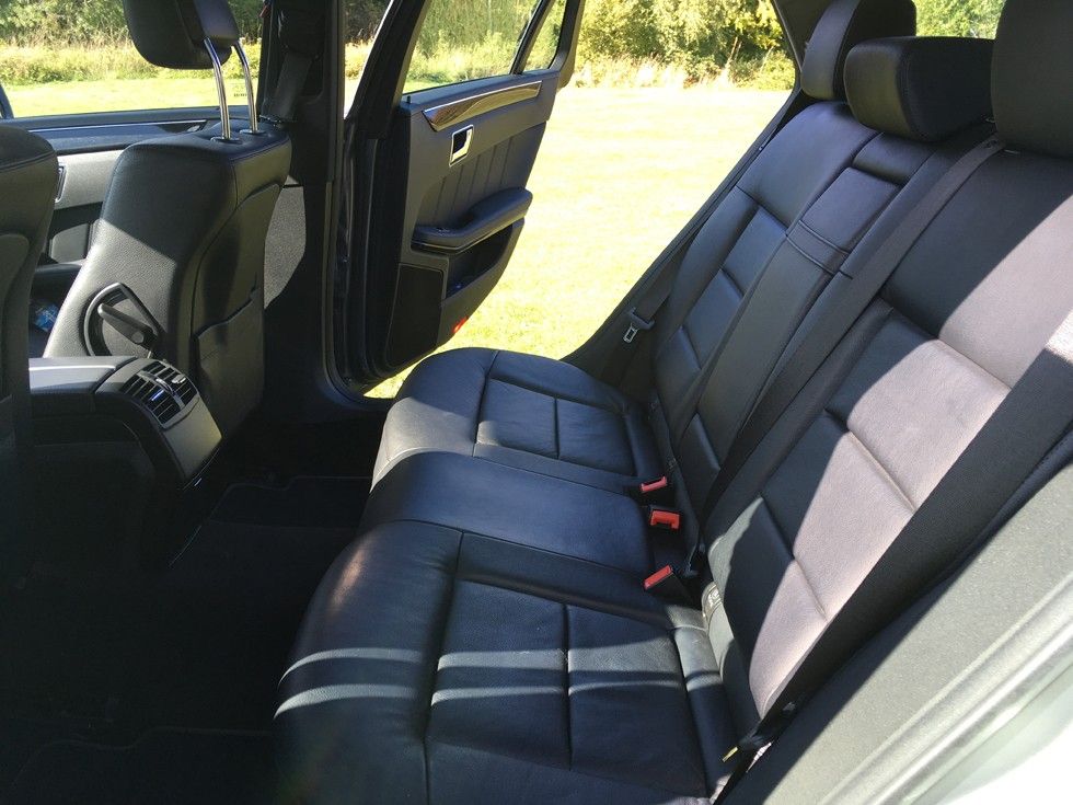 Rear leather seats of the Mercedes-Benz estate, door open